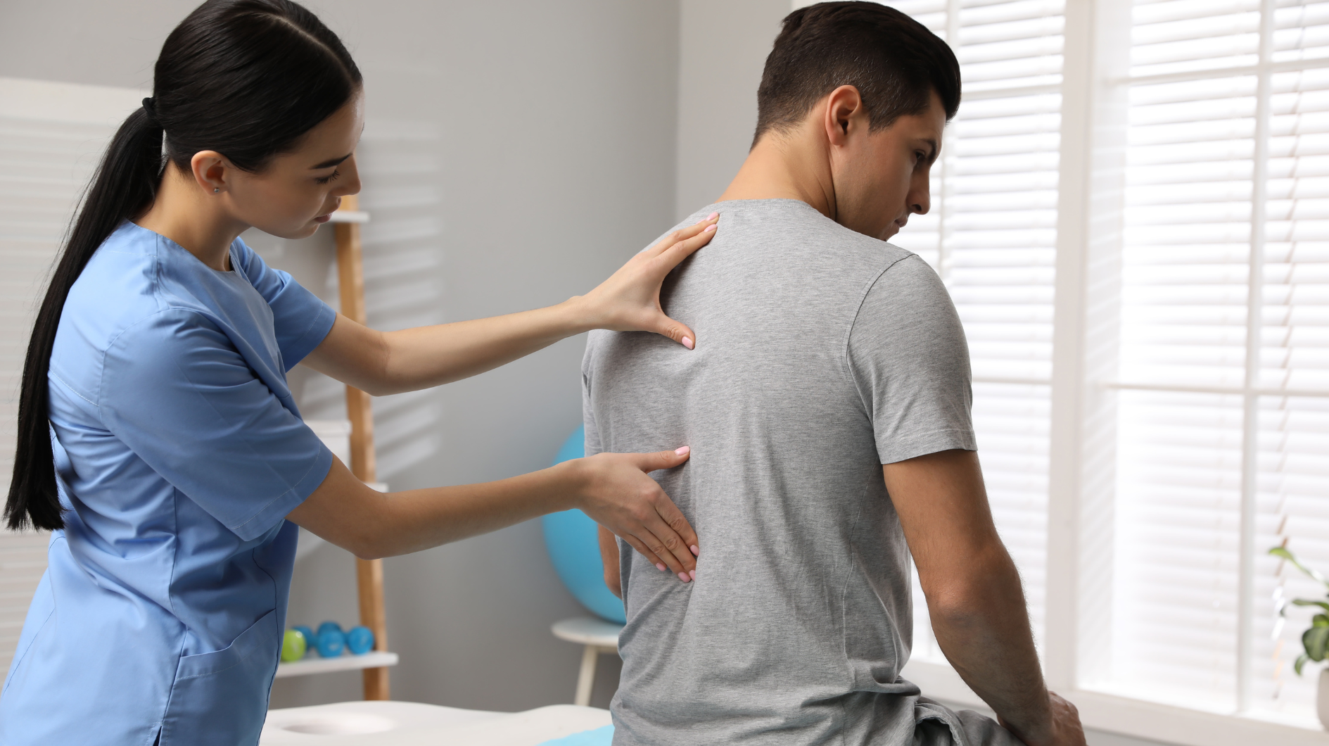 doctor massaging patient suffering from chronic pain and mental health stress