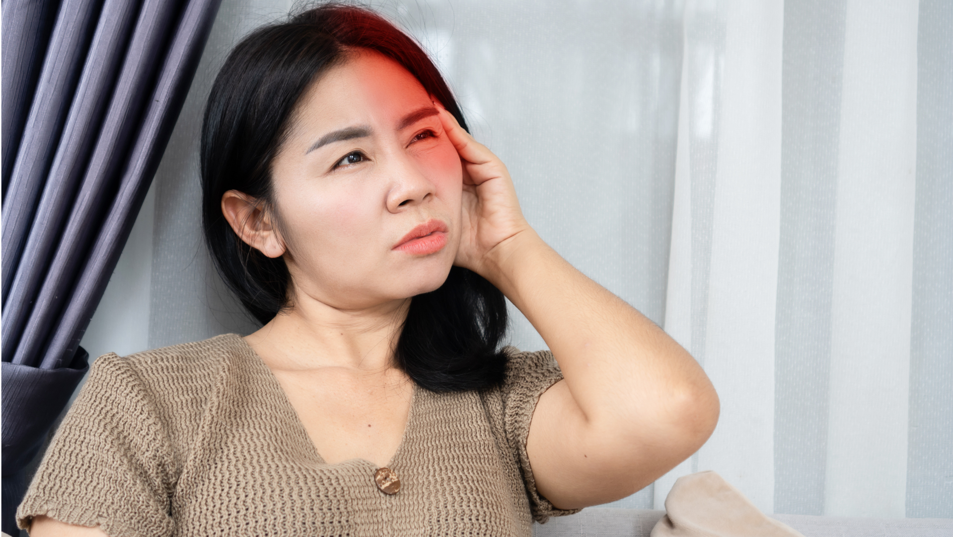 a woman sufffering from cervical neck pain that results in a cervicogenic headache